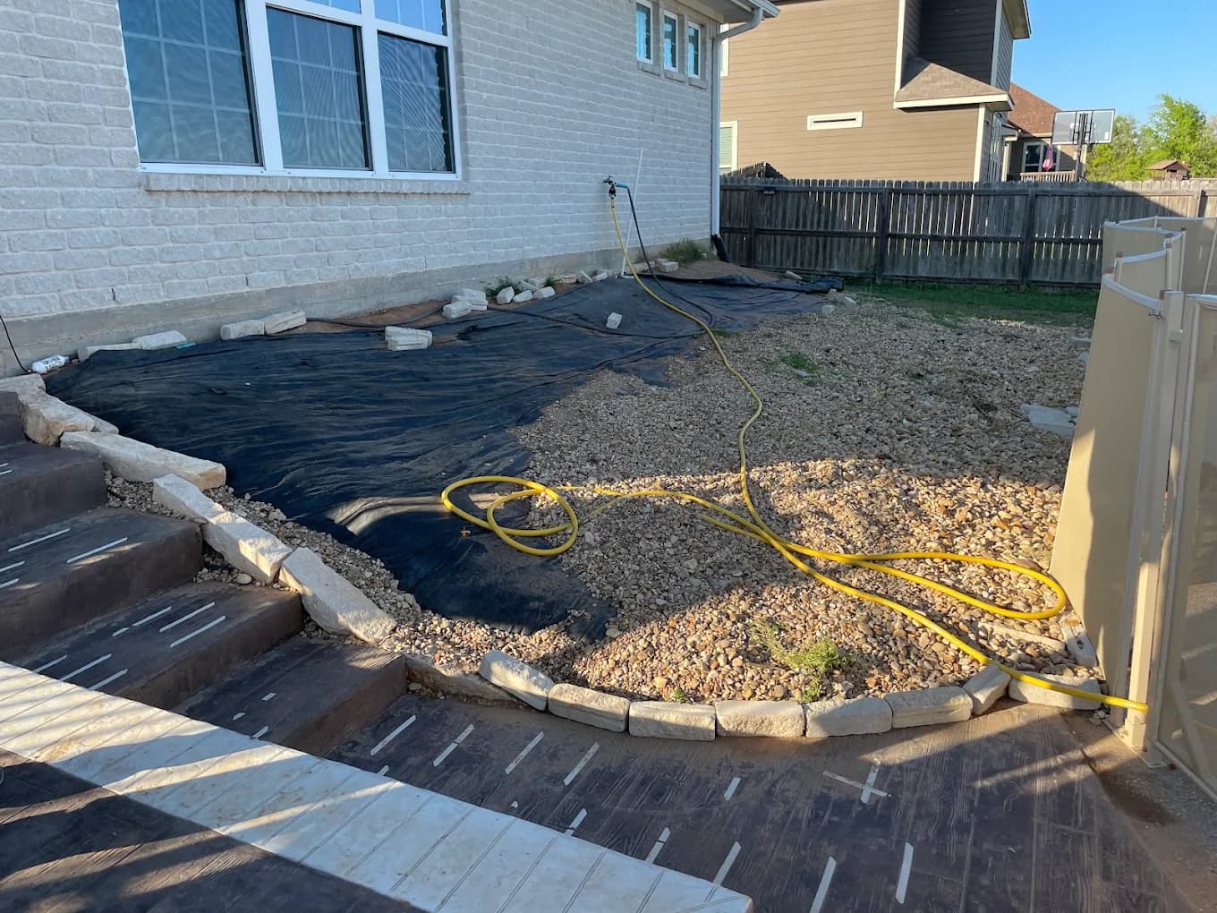 Hardscape project with stone edging and gravel